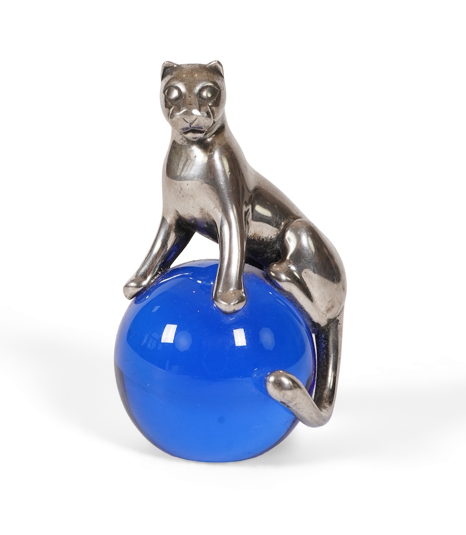 A recent Cartier paperweight, modelled as a panther upon a blue glass sphere